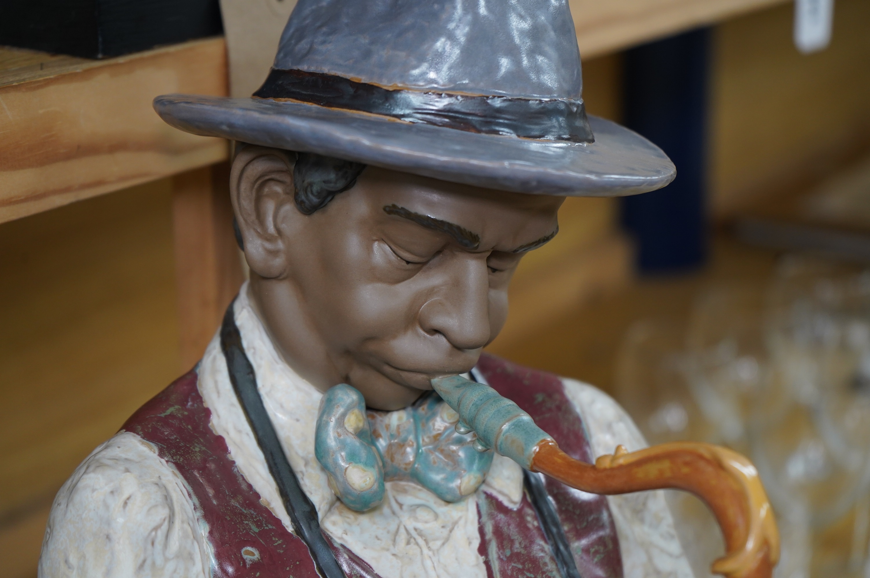 A Lladro figure ‘Playing the Blues’, 63cm high and a ‘Tall Yarn’ figure group of a fisherman and a boy. Condition - fisherman lacking the ship in his hand, otherwise good